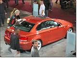  The BMW polisher-guy details the 135 to clean off grimy fingerprints.  These guys never stopped fighting their battle against smudges!