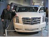  Damian violates the plane of the barrier and leans on the Cadillac Escalade.  The 'slade, popular with NBA players, exudes bling.