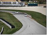  Cars at speed.  Here, a GT3 and a GT2 duel on the track.  The slower of the two has only 415 bhp.